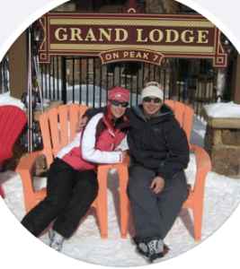 Two persons sitting on orange chairs